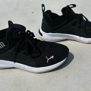 Black white puma athletic shoes